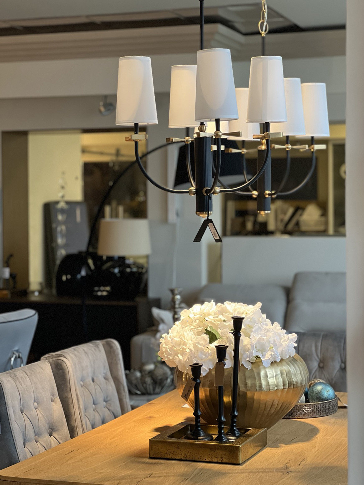 COSMOLight chandelier above a dining table in a partner showroom